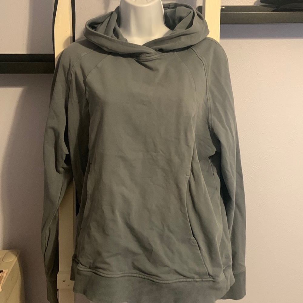 Good condition.  Lululemon pullover.  One small hole near left pocket.